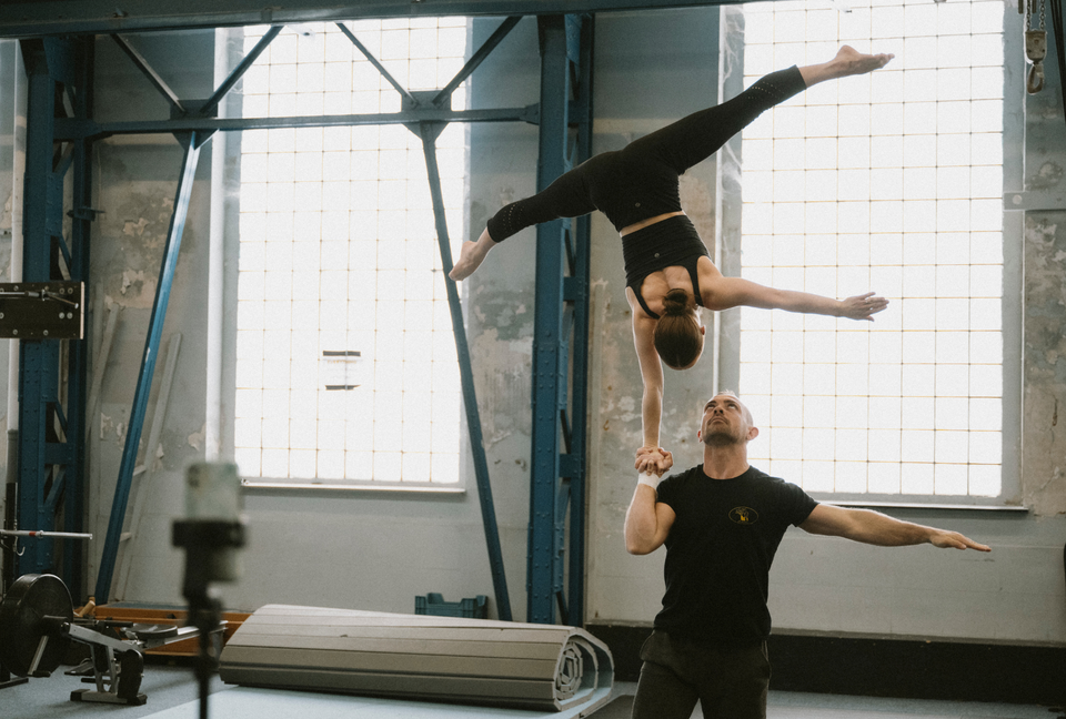 Acrobatic duo training at a circus centre - Grip aid by AcroGrip liquid chalk