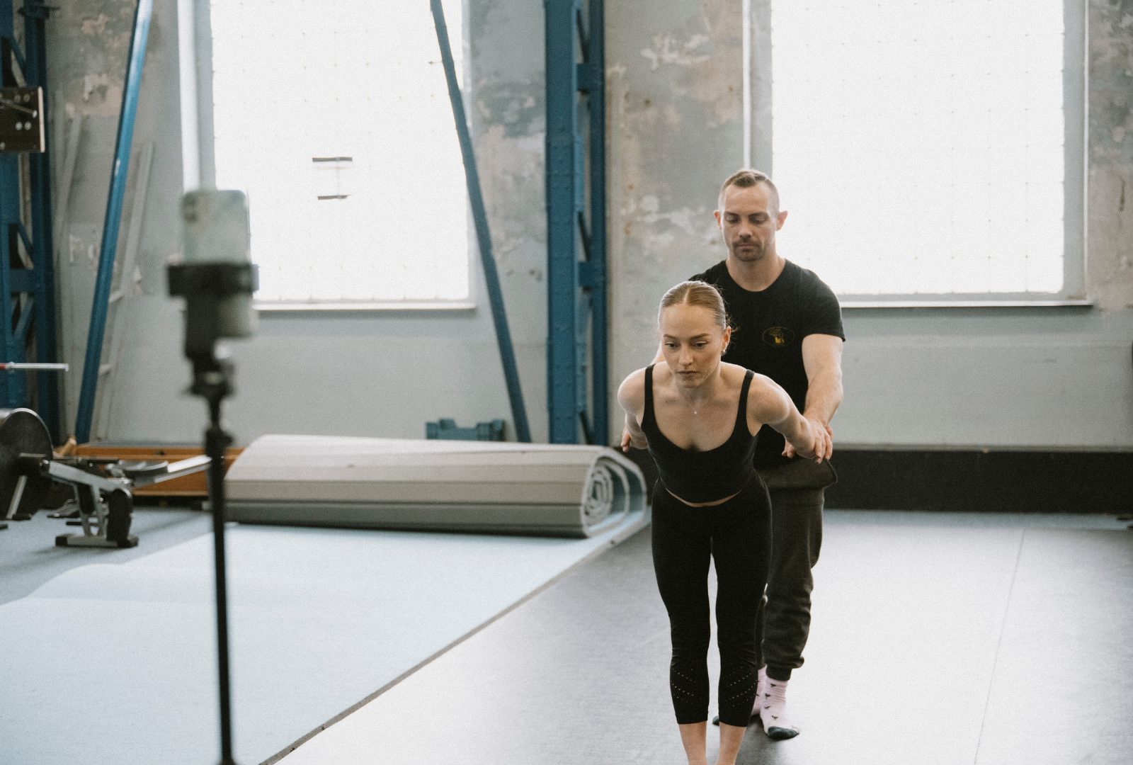 Circus duo training hand to hand at a circus centre
