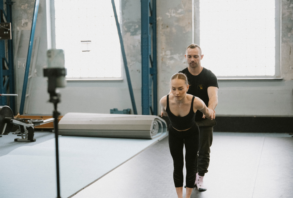 Circus duo training hand to hand at a circus centre