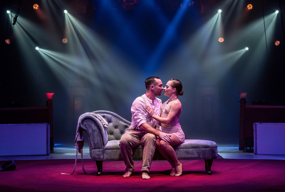 Circus duo performing a romantic hand to hand act 