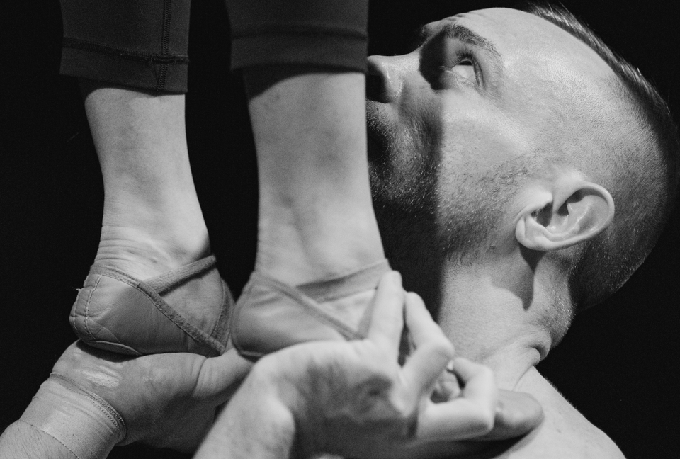 Duo acrobats performing a foot to hand skill - grip by AcroGrip liquid chalk
