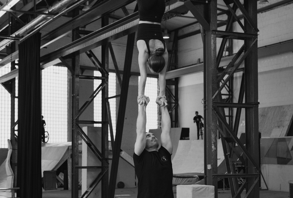 Hand to hand duo training at a circus centre - grip by AcroGrip liquid chalk
