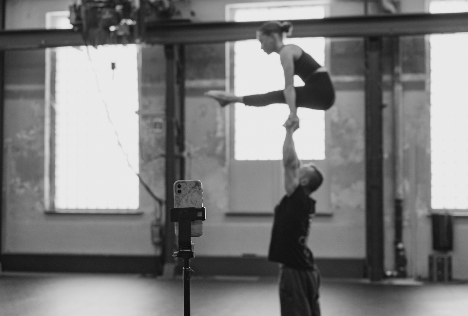 Circus duo training at a circus studio - hand to hand grip by AcroGrip liquid chalk