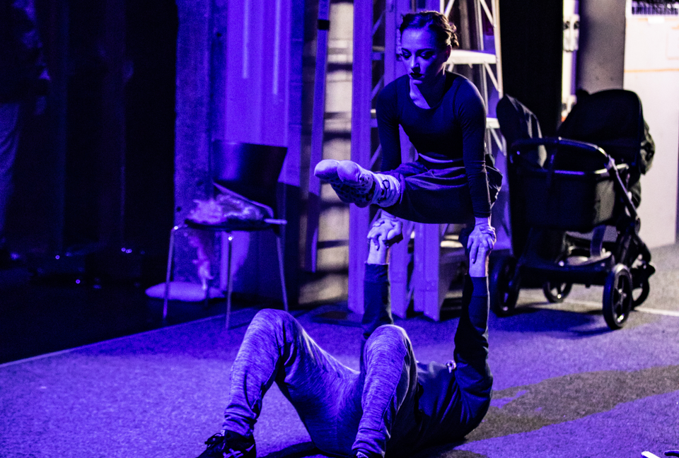 Acrobatic duo warming up backstage 
