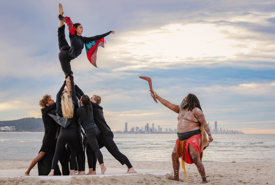 Group acrobat performing on the beach - Indigenous Australian show on the beach
