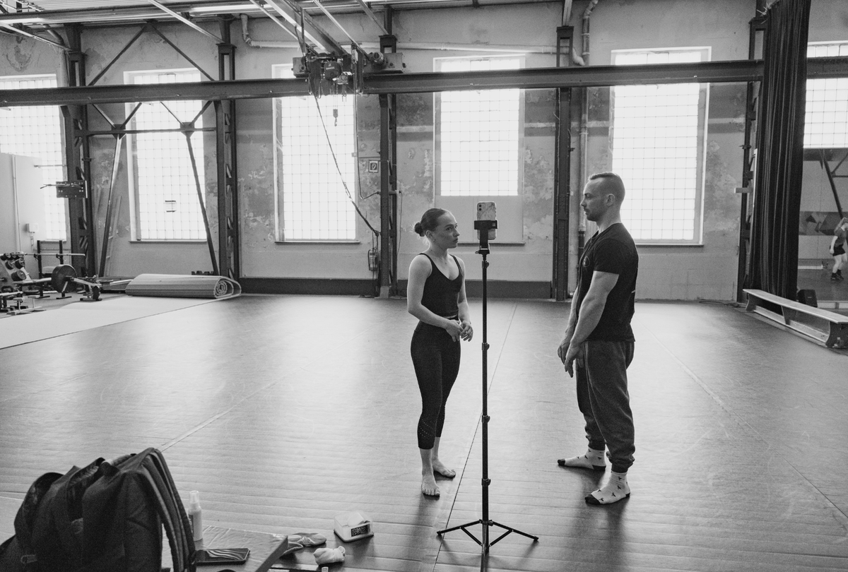 Circus duo training at a circus centre - discussing their training and performance